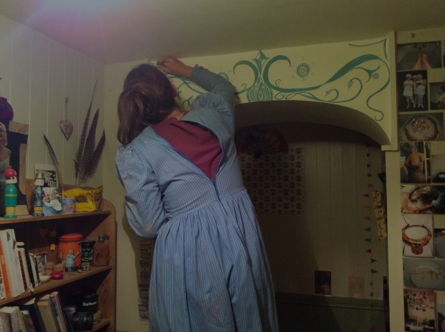 Painting the archway in my painting frock