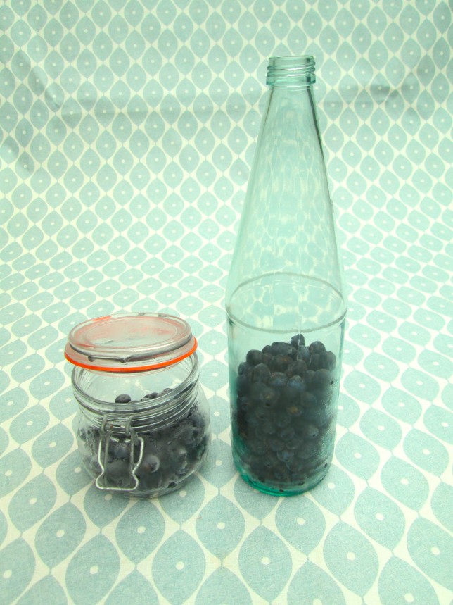 Use a large glass bottle and put in the oven on a low heat for about 20-30mins. This sterilises the bottle for you. Once you have done that, fill half the bottle with the sloes.